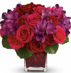 decadent gift of red and pink roses, accented with delicate purple alstroemeria and hand-delivered in a gorgeous red glass cube.