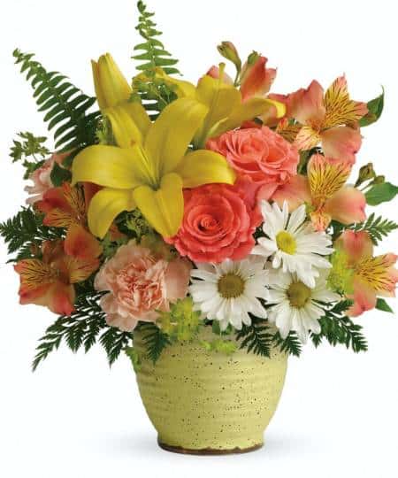 Bright as a sunny morning, this radiant rose and lily bouquet blooms beautifully inside a ceramic pot. Pot styles may vary.