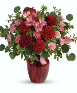 The belle of the ball! Arranged in a ruby red vase, this romantic bouquet of rich red roses and delicate pink alstroemeria is a beautiful statement of love and devotion.